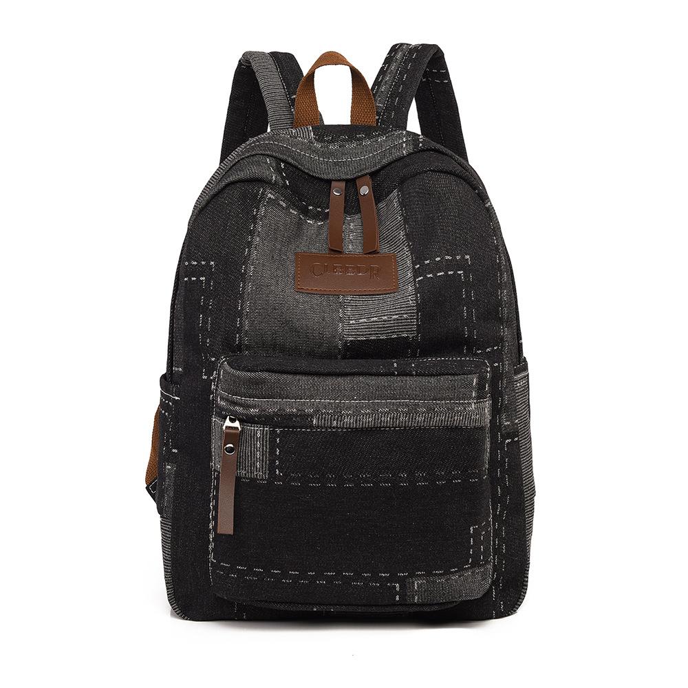 Ein gewaschener Retro-Patchwork-Denim-Rucksack für Mittelschüler