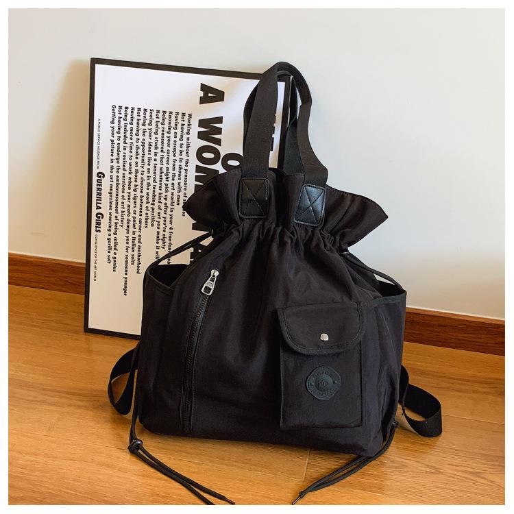 

2025 новый рюкзак модный с высоким чувством уличный досуг простой студенческий на шнурке на плечо рюкзак-мешок женский чёрный