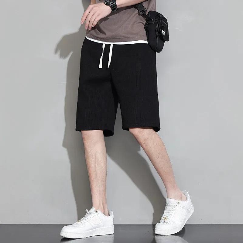 

Мужские шорты однотонные со средней посадкой летние вафельные с глубокой проймой на шнурке мужские шорты свободные до колена повседневные короткие S чёрный