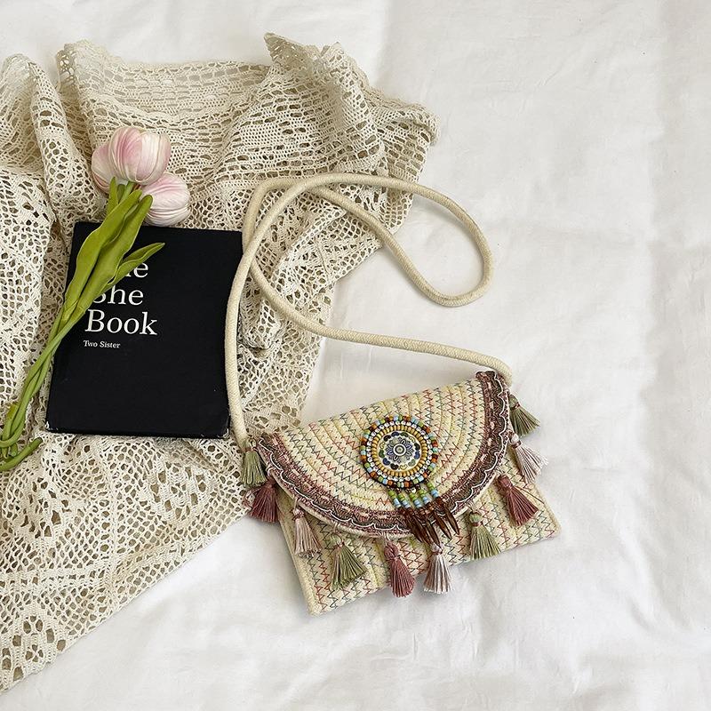 National beach woven bag women's summer new contrasting color fringed straw woven casual shoulder messenger bag