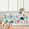A Single Whimsical Tablecloth Featuring Cartoon Ocean Animals, Adorned with Shells, Coral, And Seaweed. It Showcases a Vibrant Design of Fish And Sea 