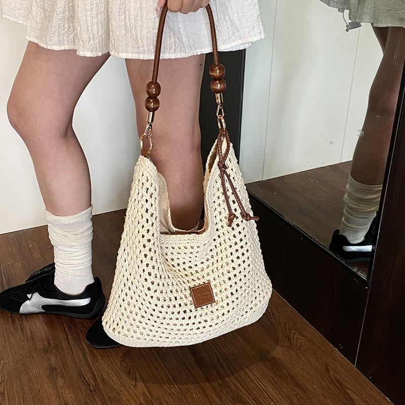 Tote bag women's 2025 new large-capacity commuter college students in class weaving soft hollow beach shoulder bag