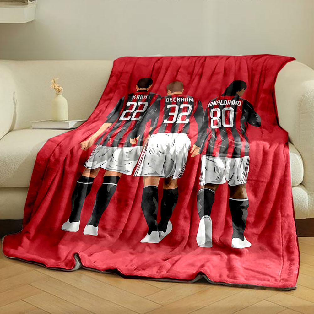 Three soccer players in red and black striped jerseys with white shorts. for all seasons blanket lunch break throw gift