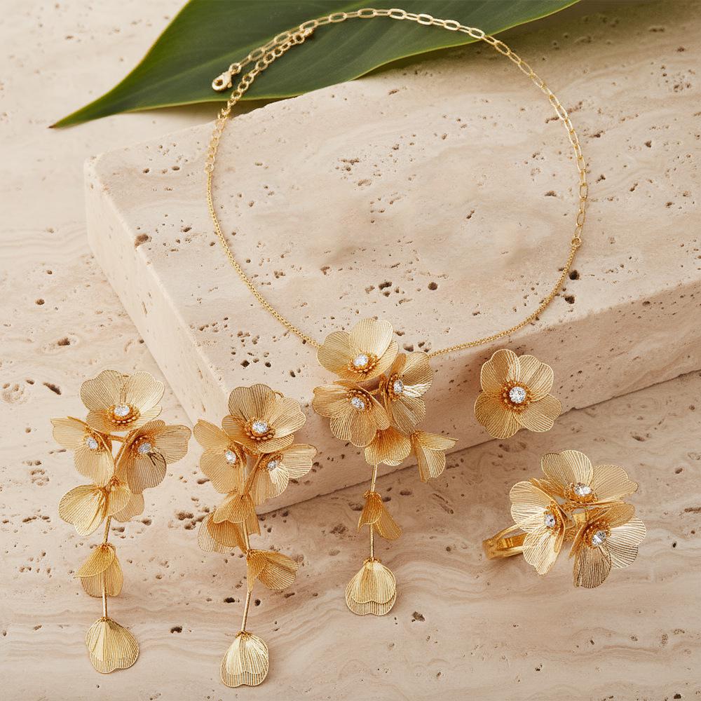 Exquisite 4-Piece Tassel Jewelry Set: Hollow Flower Necklace, Earrings, Bracelet & Ring