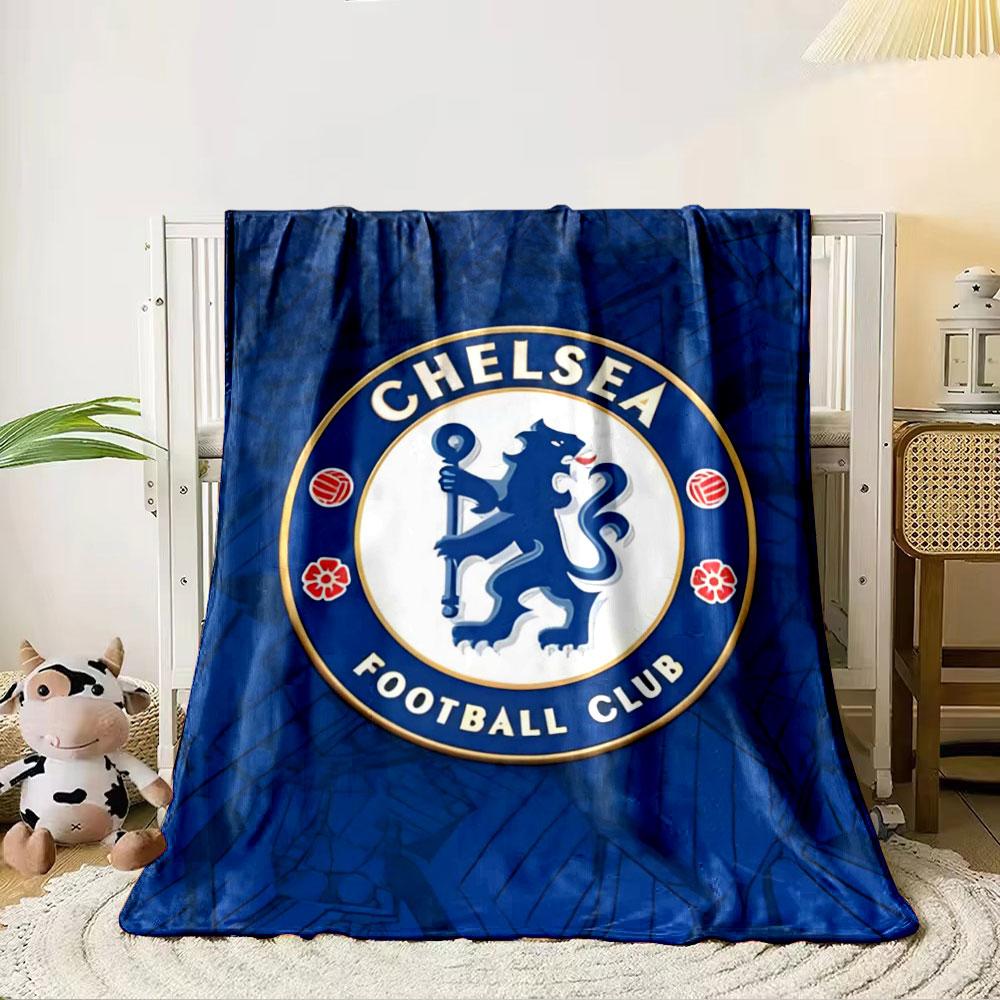 A lion holding a staff inside a circular emblem with blue and gold accents. for all seasons blanket lunch break throw gift