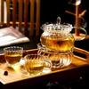 European Glass Tea Infuser Set: Includes Teapot with Filter, Glass Cups, and Saucers for Brewing Flower Tea.