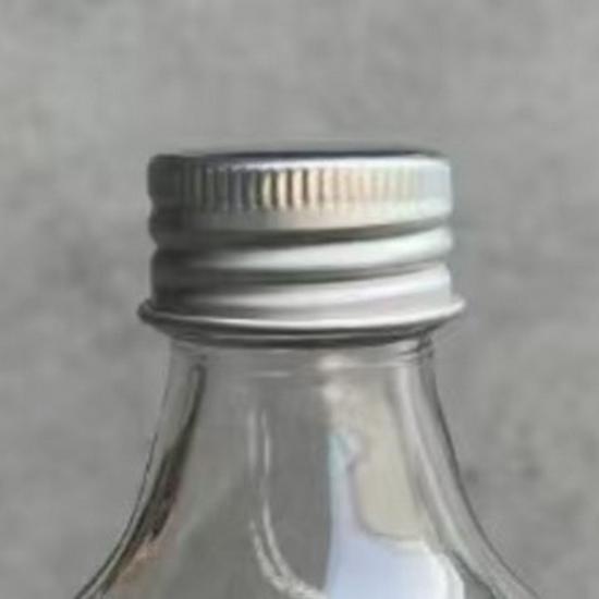 Transparent Round Glass Bottles with Lids for Juice, Milk, Tea, Cold Brew, and Coffee.