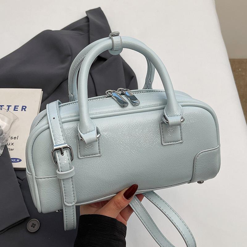 2025 Spring New Korean Version Simple Portable Bowling Bag Women's Versatile Foreign Style Commuter Premium Sense Messenger Bag