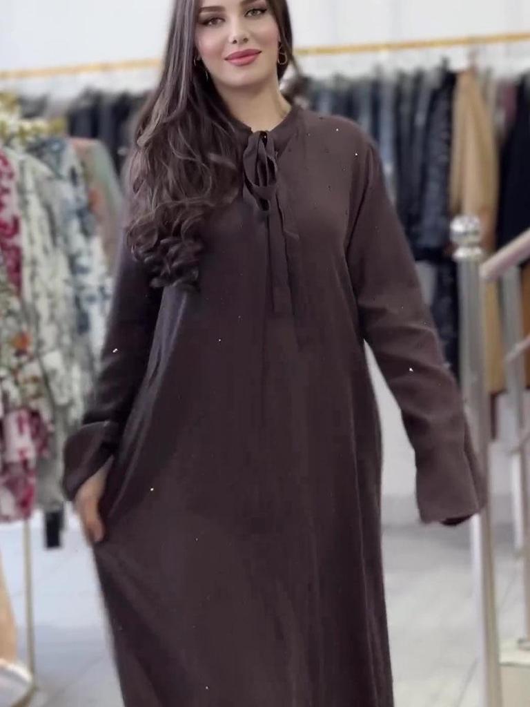 Glitzerndes Langarmkleid mit Rundhalsausschnitt und Bindedetail am Rücken