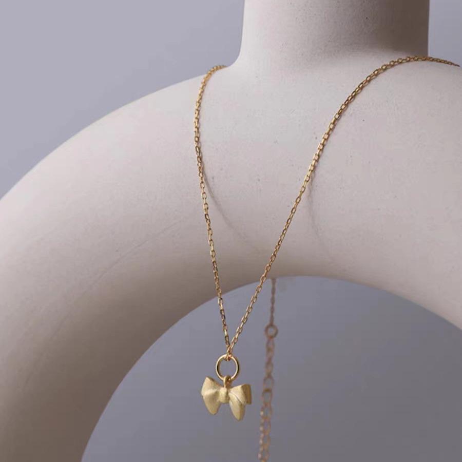 Charming Christmas Bow Pendant Necklace: Simple, Frosted Clavicle Chain for Women - Autumn Light Luxury Choker