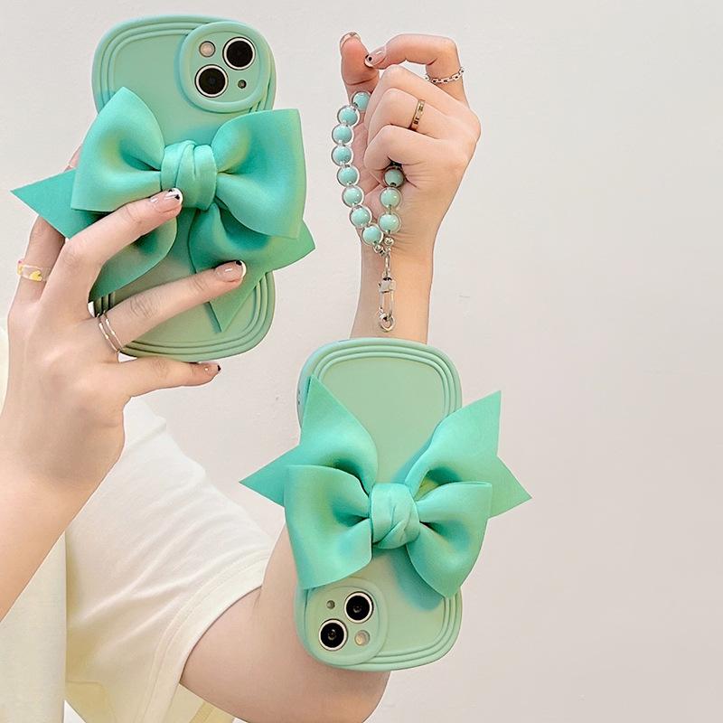 Japanese and Korean wind light green bow is suitable for Apple 17 mobile phone case iPhone16Pro Max wave soft case 14/15.