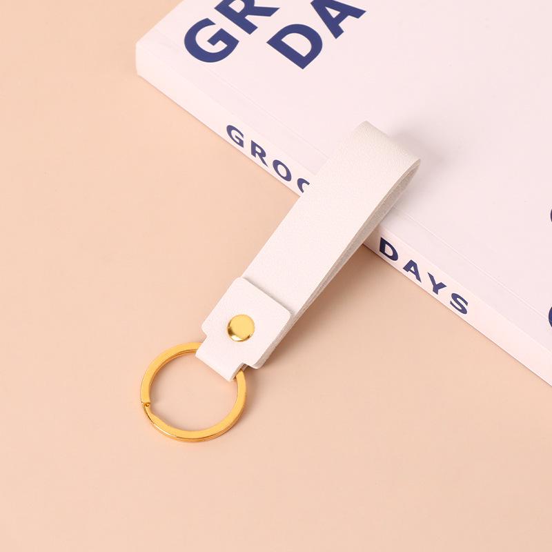 Creative Minimalist PU Leather Keychain: Solid Color Car Anti-Lost Pendant and Bag Accessory