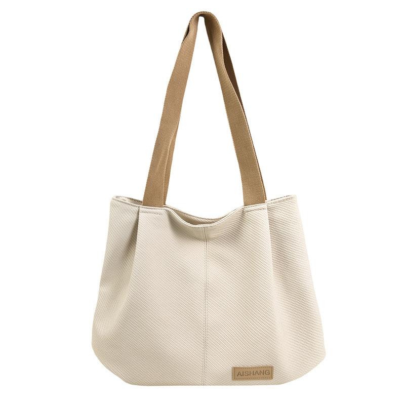 Neue trendige gewebte Muster weiche PU-Schultertasche große Kapazität lässig vielseitig College-Studenten-Klassentasche