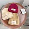 Neue Spitze Etikett Kinder Wollmütze Nuojiji Student Herbst und Winter Neu Warm und Vielseitig Ohrenschutz Strickmütze