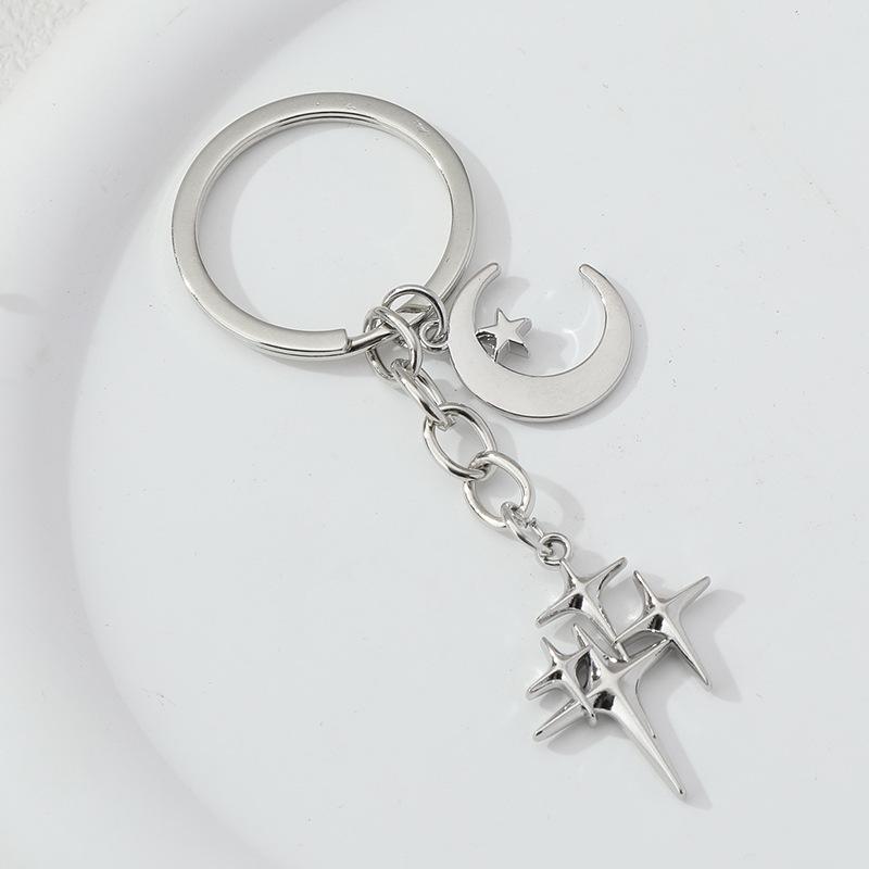Elegant Star and Moon Hollow Keychain - Unisex Fashion Bag Pendant.