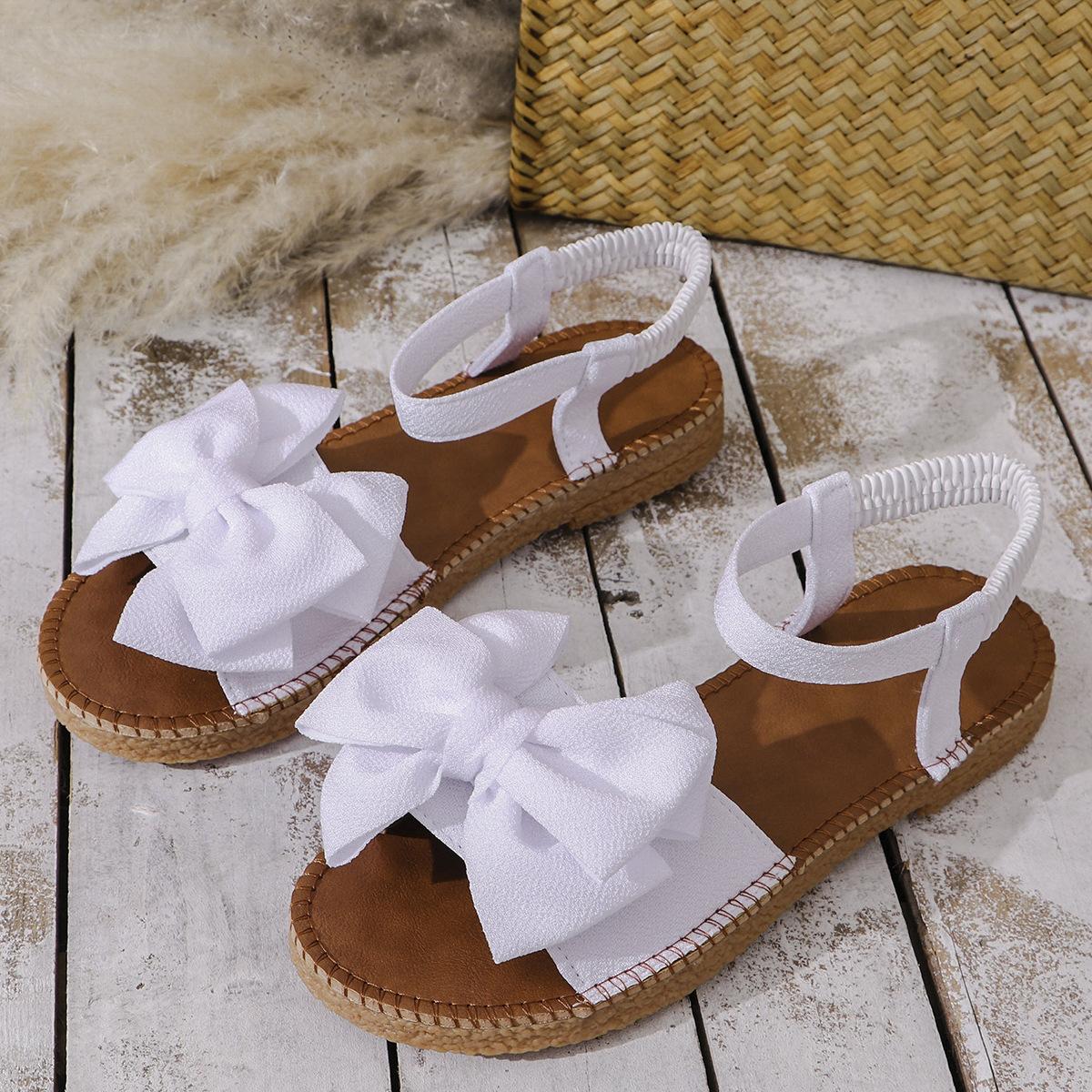 

Женские стильные розовые сандалии на плоской подошве с бантом — легкая повседневная летняя обувь с эластичной резинкой, без застежек и удобной резиновой подошвой 38 белый