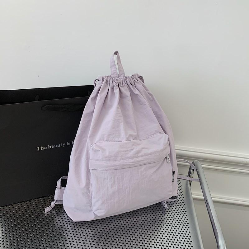 Japanese new simple light backpack commuter backpack drawstring pocket casual sports backpack men's and women's school bags