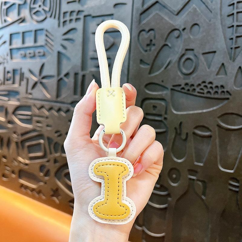 Kreativer Leder-englischer Alphabet-Schlüsselanhänger Dopamin-Taschenanhänger Schmuckzubehör Geschenk Autoschlüsselanhänger
