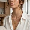 Fashion retro sunflower pendant pearl necklace plated 18K gold stainless steel personalized high-end sweater chain