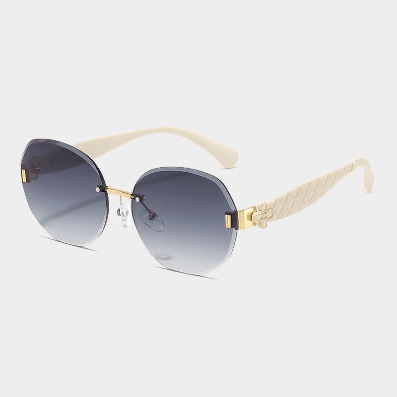 Women's Egg-Shaped Stylish Frameless Retro Sunglasses for Summer Photoshoots