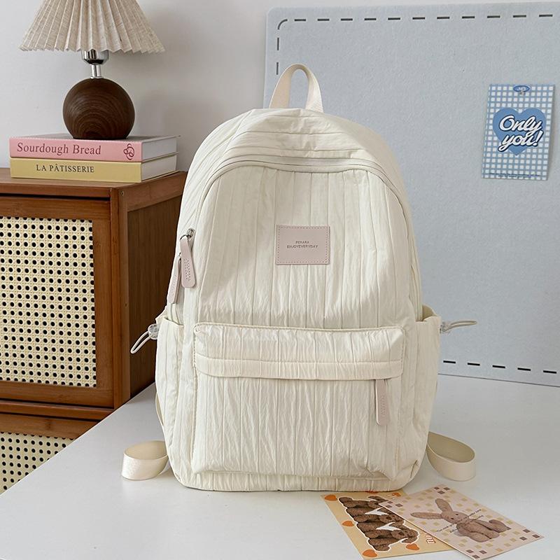 School bag junior high school girls large capacity solid color light primary school backpack high value girl versatile backpack