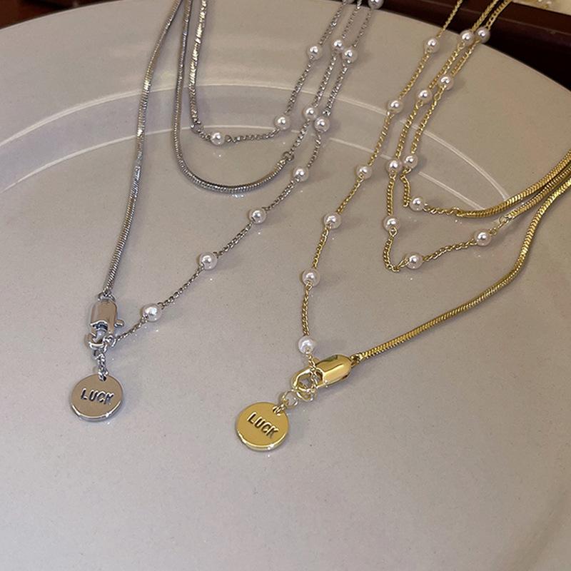 2023 Elegant Pearl Pendant Necklace: Niche Design Sweater Chain for Women