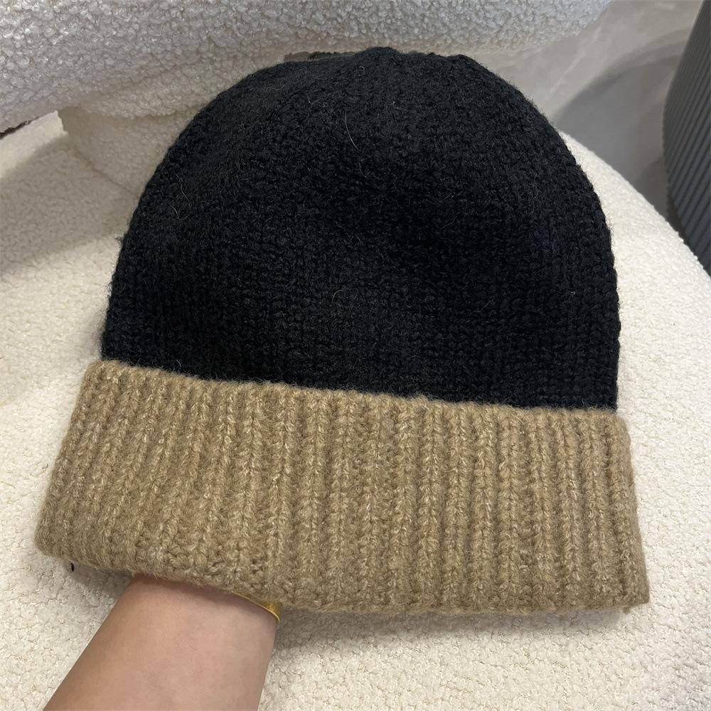 Simple two-color splicing wool hat women's autumn and winter warm niche versatile ear protection hat large version knitted pullover hat tide