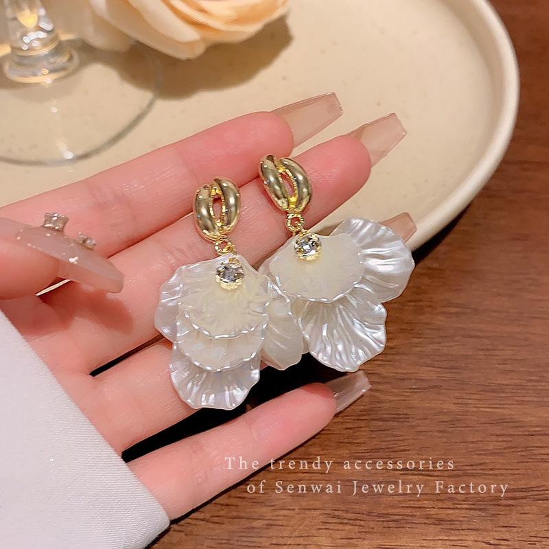 Retro super fairy white petal earrings women s cold wind exaggerated studs French temperament earrings