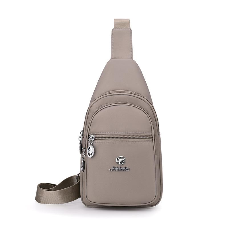 

Женская наплечная сумка Легкая водоотталкивающая нейлоновая сумка Большая вместимость Уличная нагрудная сумка бежевый