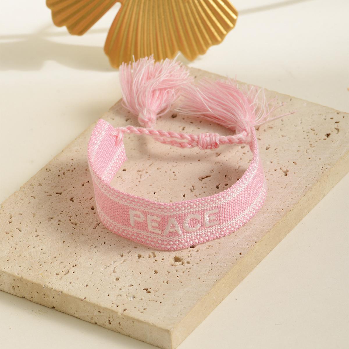 

Trendy Handmade Woven Bracelet with Embroidered Letter рожевий