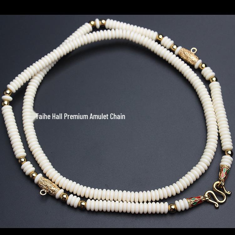 

Сохраняющее цвет прочное кокосовое ожерелье с кулоном-амулетом из Таиланда - Доступно в вариантах из одной или трех нитей Default