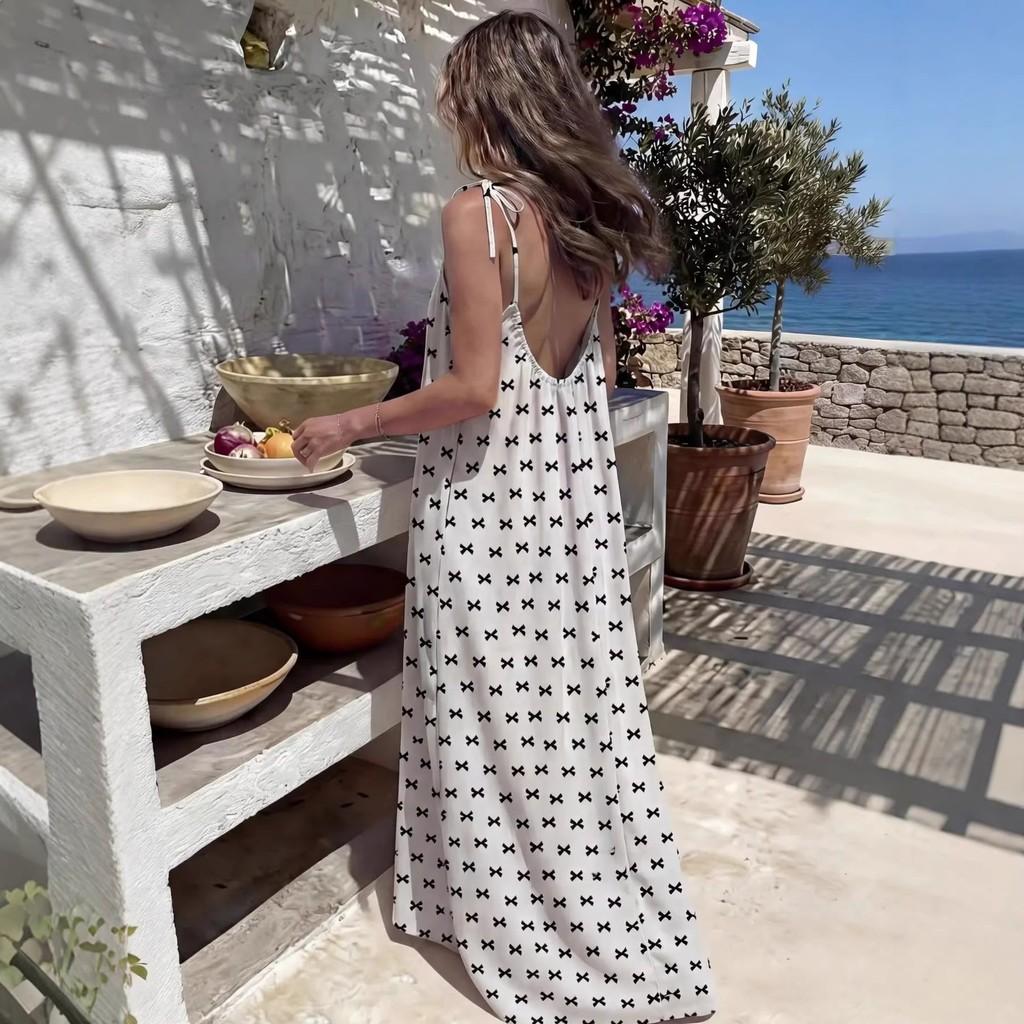 Abito estivo da donna con stampa a pois e gonna lunga svolazzante per la spiaggia e l'uso casual