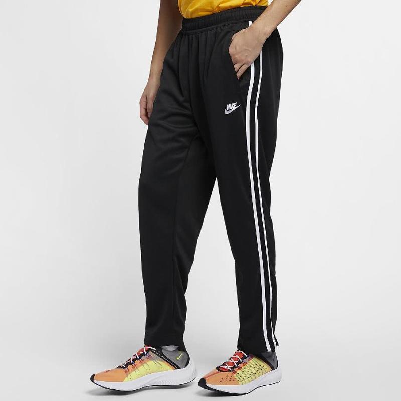Nike Dzianinowe joggery męskie z lampasem bocznym i mankietami zapinanymi na zamek, czarne AR2247-010