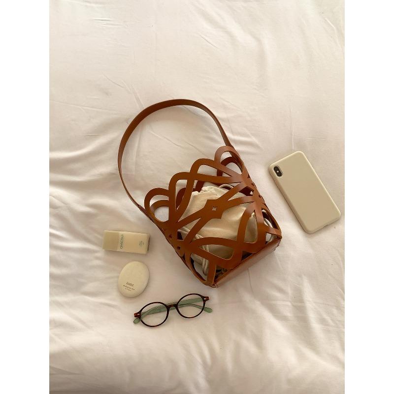 

Hollow bag women s summer new lazy wind bucket bag niche design single shoulder underarm bag women коричневый