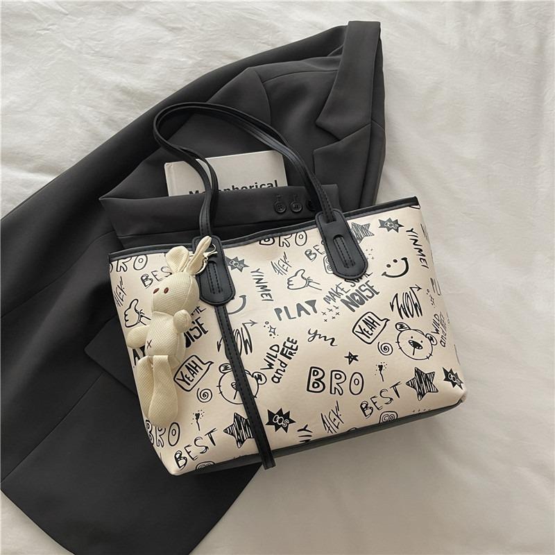 Printed fashion commuting large capacity new personalized pendant autumn popular casual shoulder tote bag