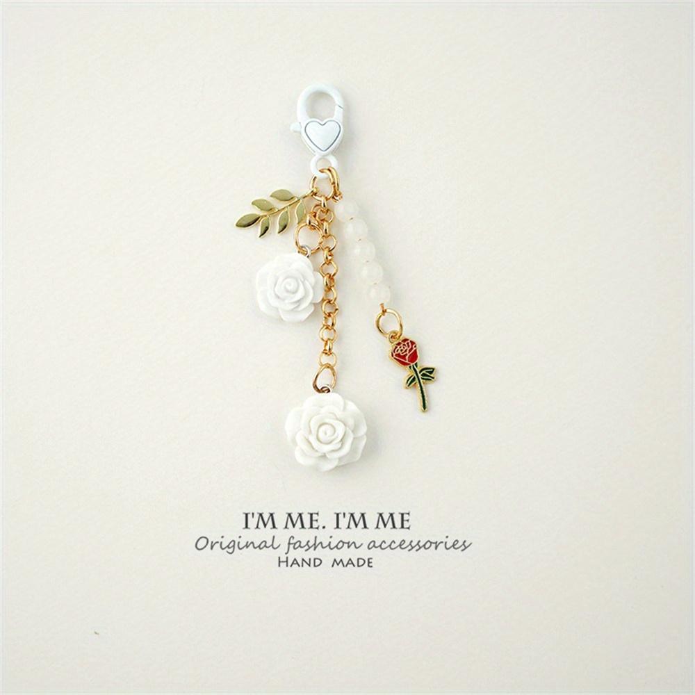 3D ვარდის ფისოვანი კამელიის გულსაკიდი გასაღების საკიდი მარგალიტის შენადნობი ქალებისთვის მანქანის გასაღების საკიდი ყურსასმენის ქეისი ხელჩანთის აქსესუარები