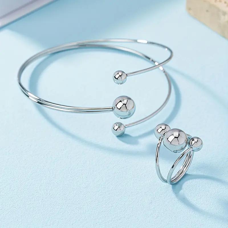 

Gold and Silver Layered Bangle and Ring Set: Elegant Women s Wrist and Finger Jewelry