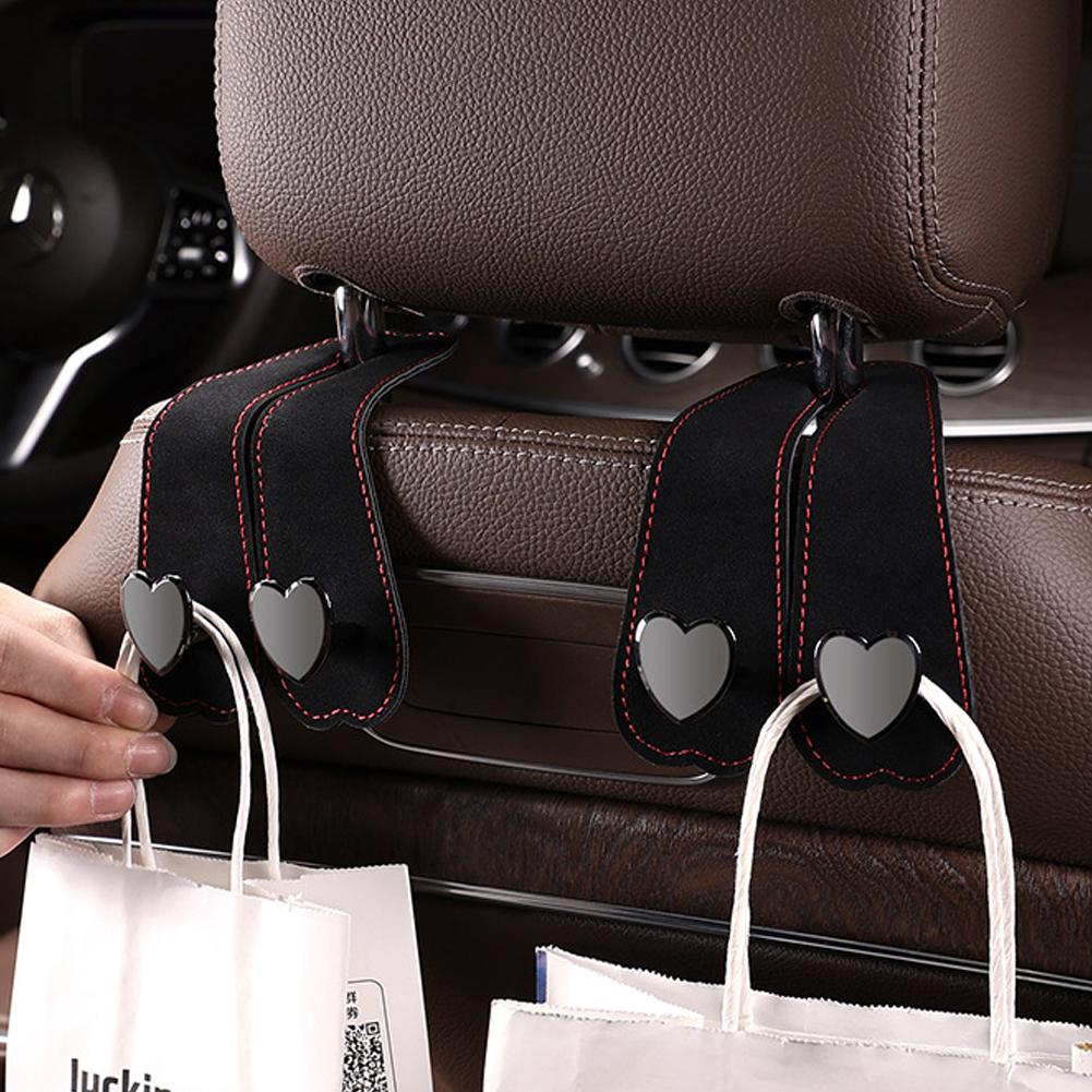 Kopfstützenhaken für Autositze 2 in 1 Leder Herzform Metall Rückenlehnenhaken Handtaschen- und Taschen-Rucksack Doppelhaken Sitzaufhänger