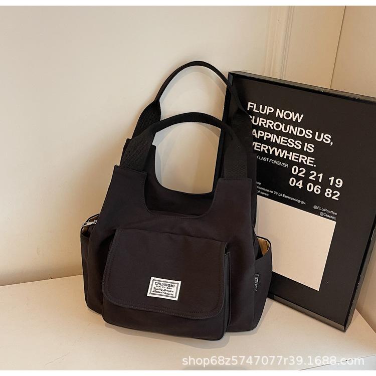 Commuter bag Japanese ins retro niche design canvas bag solid color casual versatile tote bag handbag women