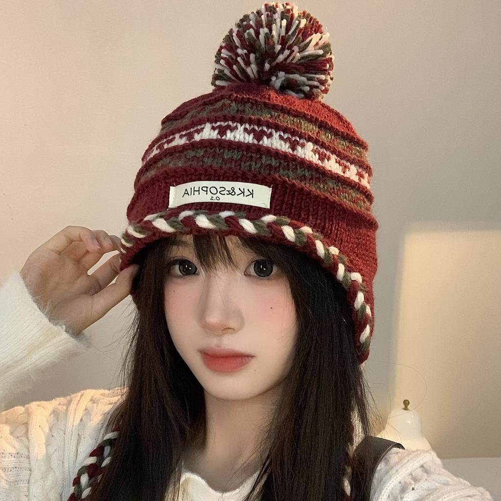 Cozy Chic Knitted Winter Hat For Women Featuring Colorful Pom Poms And Warmth