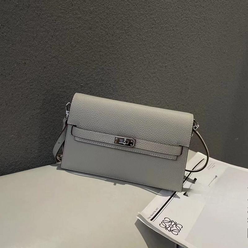 New lychee pattern leather half cover hand grab bag genuine leather women's bag single shoulder underarm bag oblique span bag wholesale