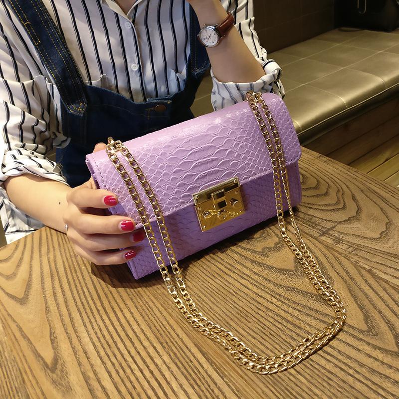 black crossbody purse with gold chain