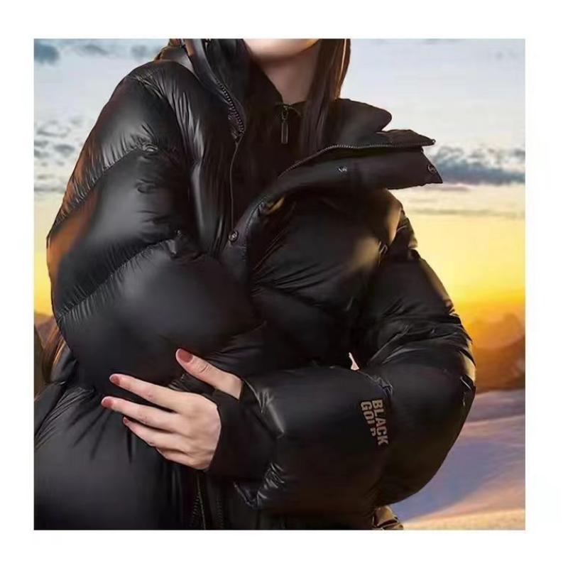 Høst- og vinter Svart gull dunjakker for menn og kvinner, fasjonable løse fortykkede jakker og jakker