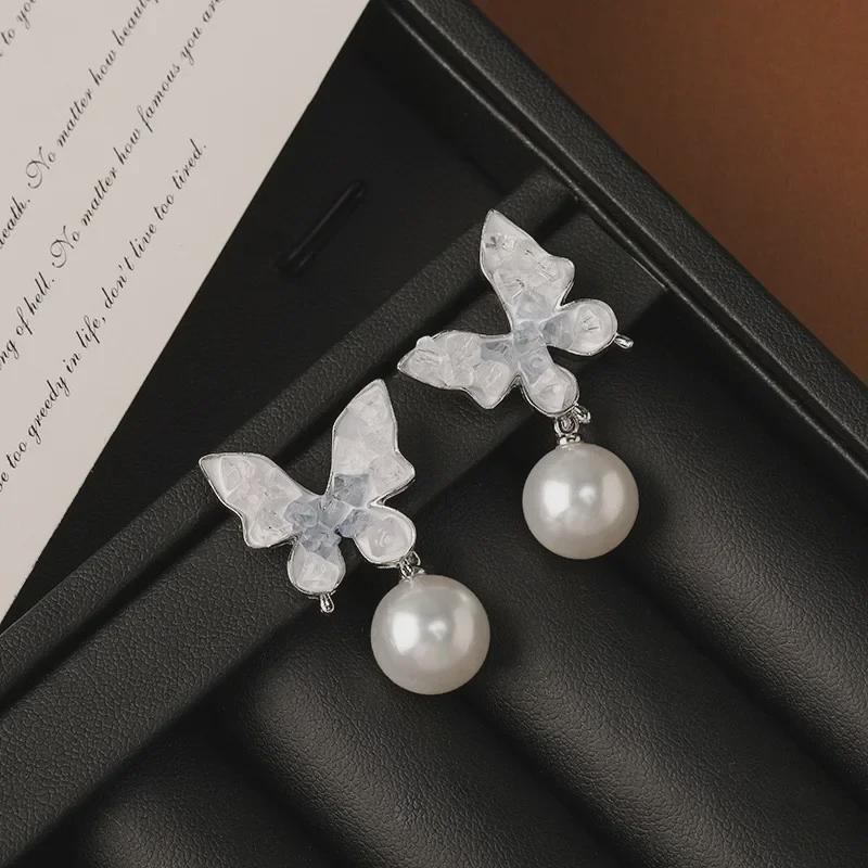 Silver Needle Crystal Butterfly Tassel Earrings with Pearls - Elegant, Nature-Inspired Jewelry for Women.