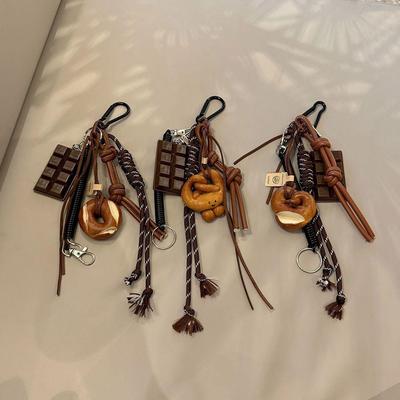 Autunno e inverno marrone adorabile pane alcalino coreano Ins borsa pendente cioccolato corda da arrampicata portachiavi catena decorativa mano