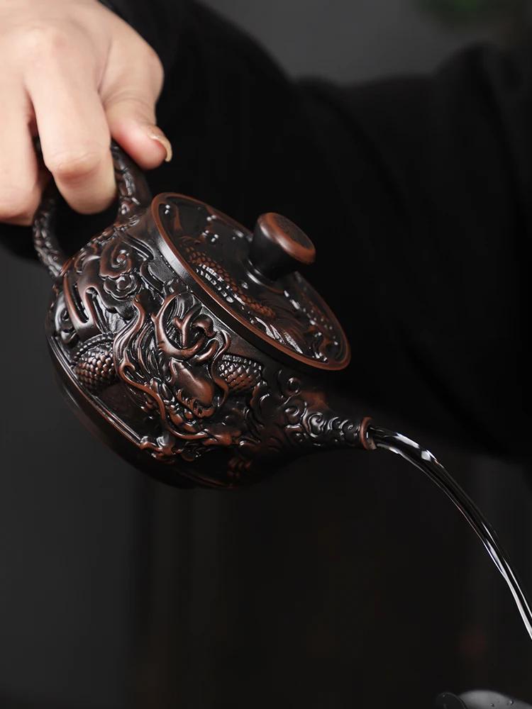 Teapot purple pottery material large capacity pure hand-carved retro relief desktop ornament household Chinese gift rotary pot