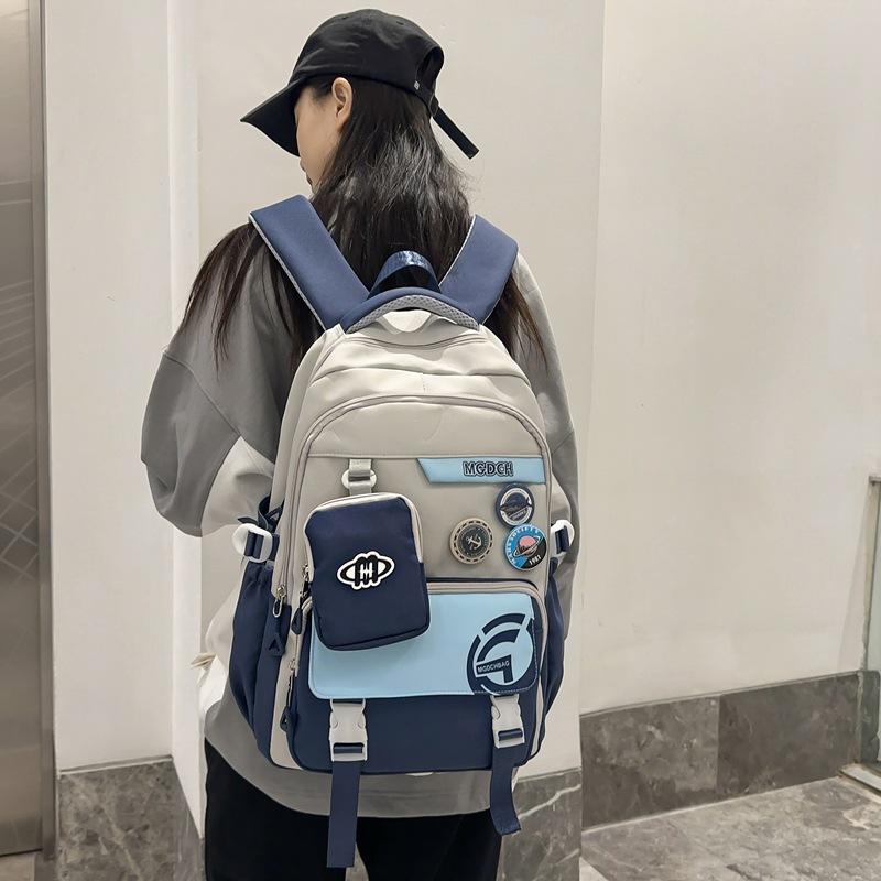 Stylish and Exquisite Contrasting Color Badge Large-capacity Backpack 24 New Primary School Junior High School Boys and Girls Schoolbag