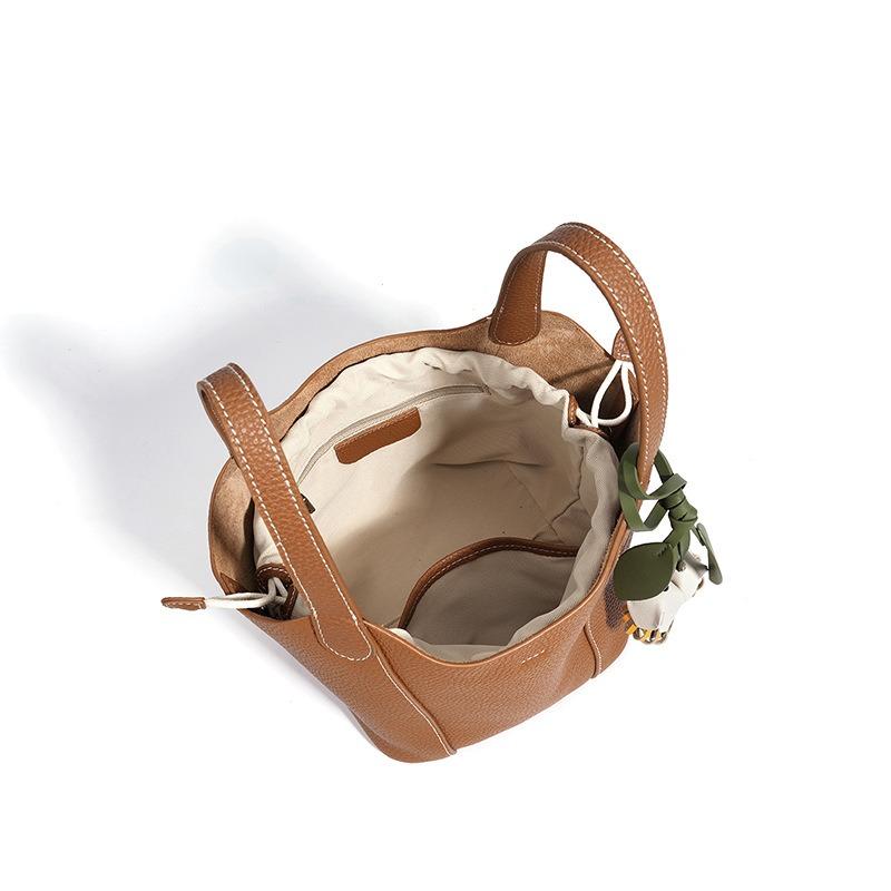 Bolso de mujer de piel de vaca de primera capa, bolso de hombro casual y simple, bolso cruzado de cuero con sensación de nicho, bolsa tipo cesta de verduras de cuero