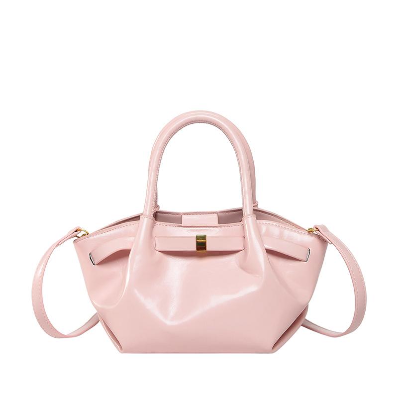 

New high-end oil wax leather simple pleated portable bucket bag niche design versatile commuter messenger bag bag women розовый