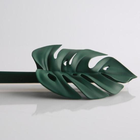 Nástroj na čištění sprchové stěrky ve tvaru zeleného listu